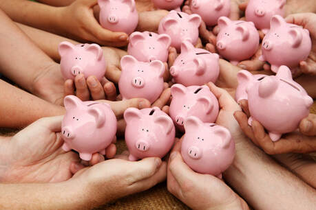 Picture of a large group of hands holding piggy banks