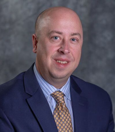 Professional business head shot picture of Jon Conklin
